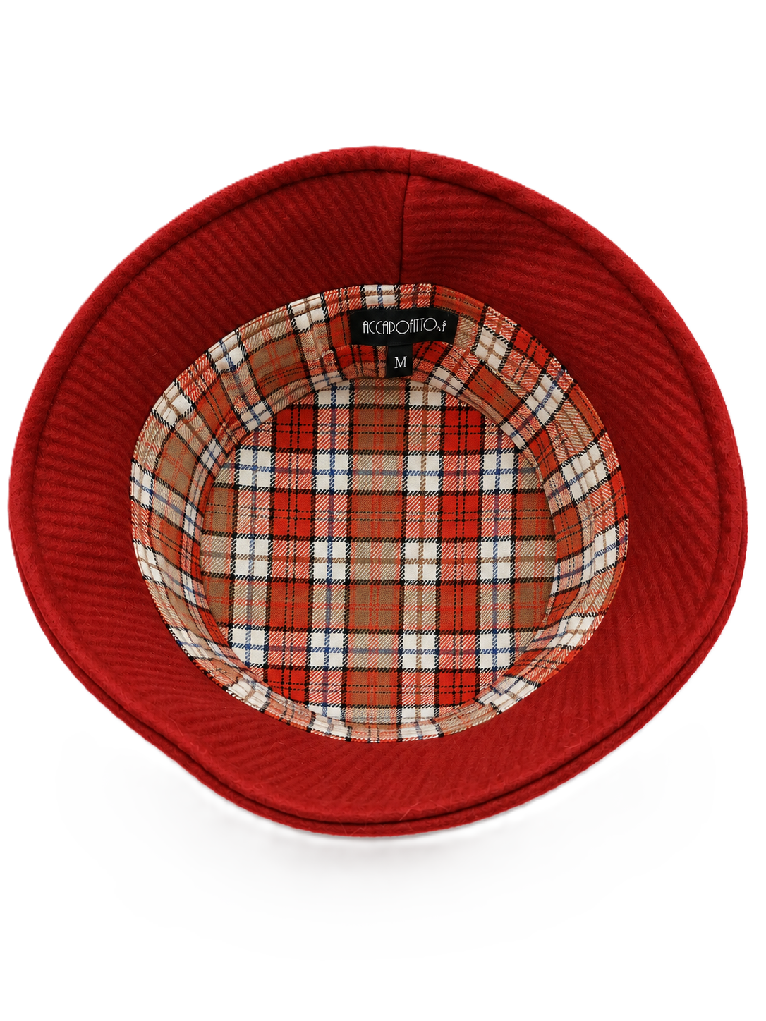 Cappello Bonnie del brand Accapofitto: bucket hat in lana vergine color arancione con etichetta metallo. Visione della fodera inetrna scozzese sui toni dell'arancione e del bianco